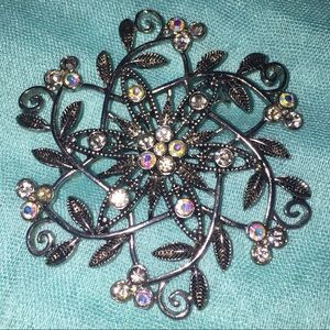Silver tone vine design brooch